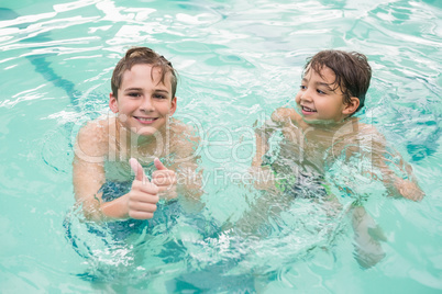 Cute little kids in the swimming pool