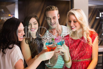 Young friends having a drink together