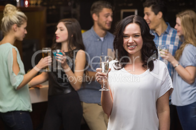 Pretty brunette having a glass of champagne