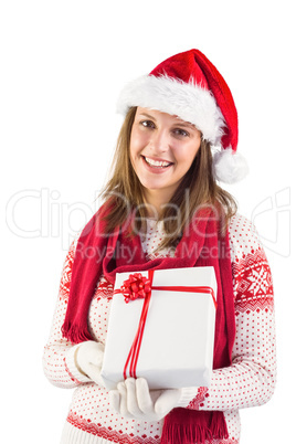 Festive brunette holding a gift