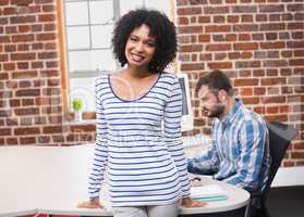 Smiling young businesswoman in office