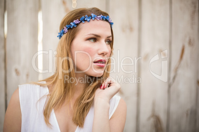 Blonde woman wearing headband looking away