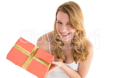 Cute blonde holding a gift