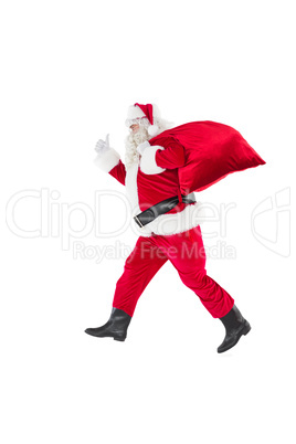 Positive santa with a sack and thumbs up