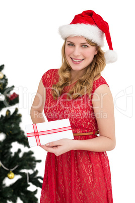 Blonde in santa hat holding a card