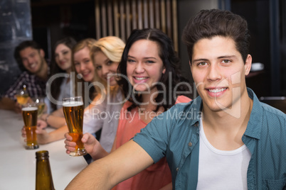 Young friends having a drink together