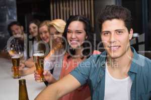 Young friends having a drink together