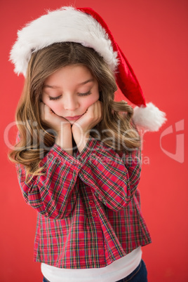 Sad little girl in santa hat