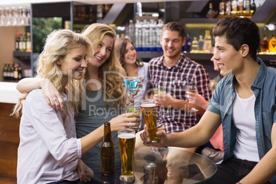 Young friends having a drink together Young friends having a drink together