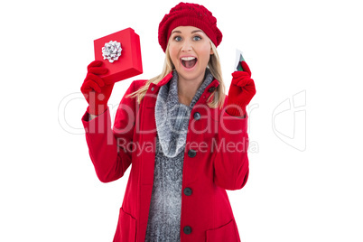 Festive blonde holding gift and credit card