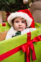 Cute baby boy in large christmas present