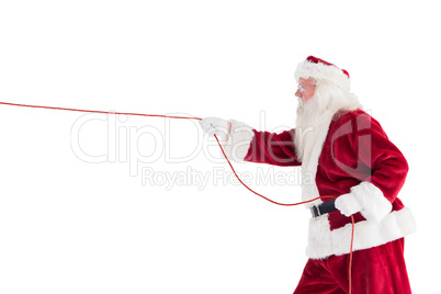 Santa pulls something with a rope