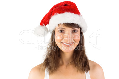 Brunette in santa hat smiling at camera