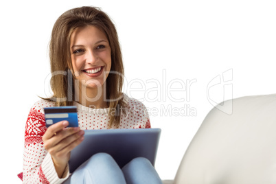 Woman doing online shopping with laptop and credit card