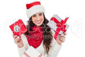 Happy brunette holding christmas gifts