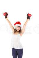 Festive brunette cheering with boxing gloves