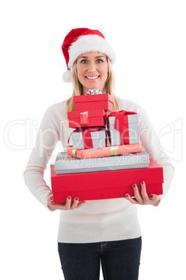 Festive blonde holding pile of gifts