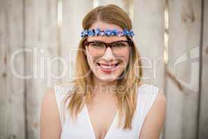 Smiling blonde woman wearing glasses and headband