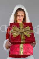 Surprised woman opening a gift