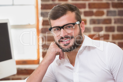 Smiling young businessman in office