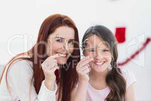 Festive mother and daughter baking together