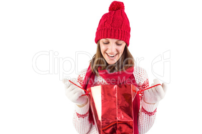 Smiling santa woman looking into shopping bag