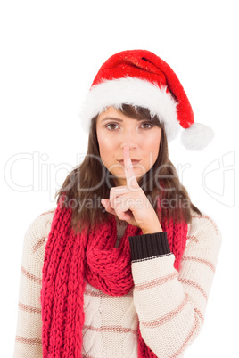 Festive brunette keeping a secret