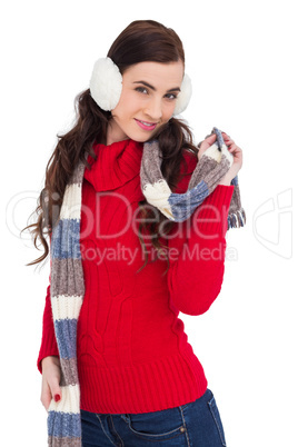 Happy brunette in winter clothes posing