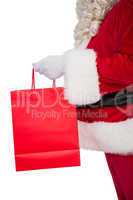 Father santa holding a shopping bag