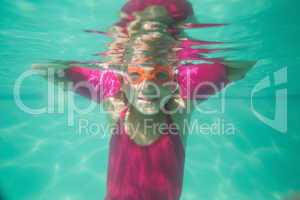 Cute kid posing underwater in pool