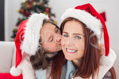 Festive mother and daughter on the couch Festive mother and daughter on the couch