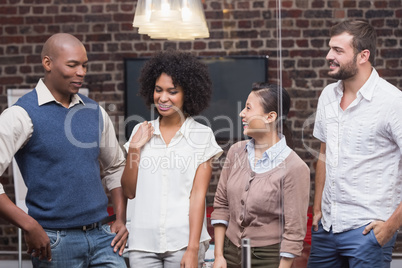 Cheerful young business people in office