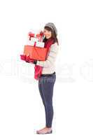 Pretty woman holding pile of gifts