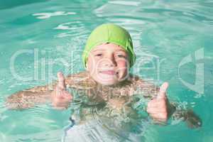 Cute kid swimming in the pool