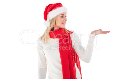 Festive blonde holding hand out