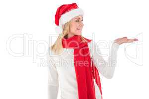 Festive blonde holding hand out