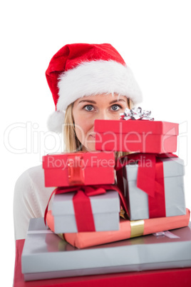 Festive blonde holding pile of gifts