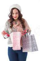 Brunette in winter clothes looking in shopping bag
