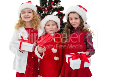 Festive little siblings holding gifts