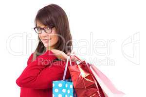 Happy brunette holding shopping bags