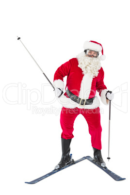 Portrait of happy santa claus skiing
