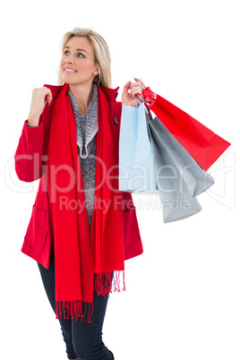 Blonde in winter clothes holding shopping bags