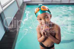 Cute little boy with his medal at the pool