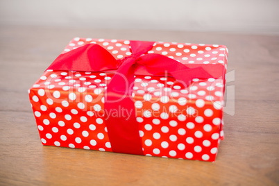 Red and white gift on table