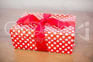 Red and white gift on table