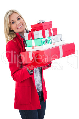 Festive blonde holding many gifts