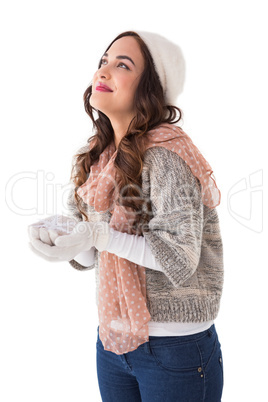 Brunette in winter clothes with hands out