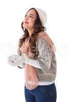 Brunette in winter clothes with hands out