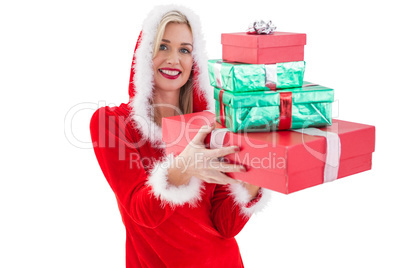 Festive blonde holding pile of gifts