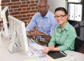 Smiling photo editors in office